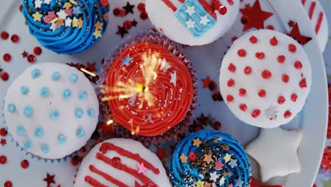 burning sparkler on decorated cupcakes