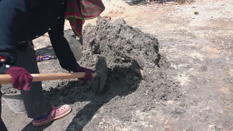 Two-Workers-Mixing-Concrete-on-a-Sunny-Day