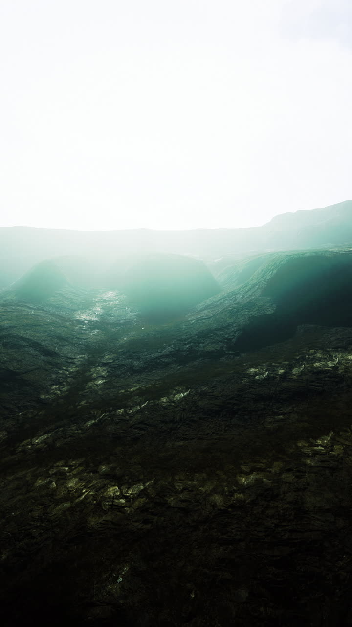 Majestic landscape bathed in ethereal light from a distant sunrise