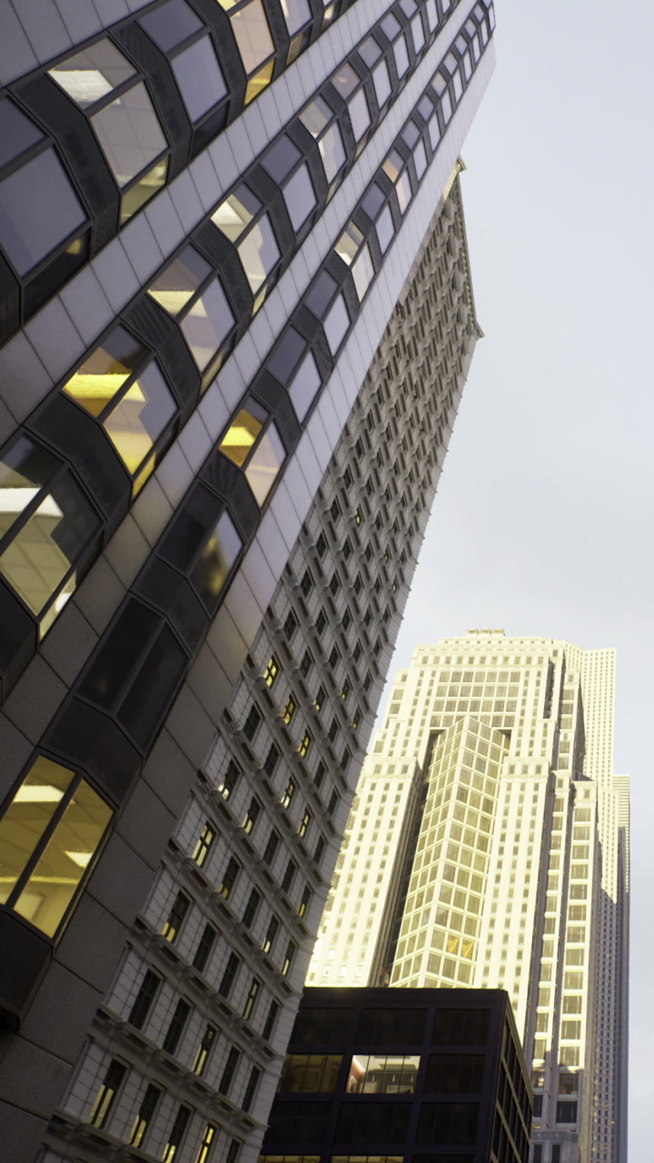 Buildings reflect light in city during evening hours