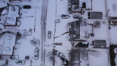 an aerial view of a quiet, suburban neighborhood after a nor'easter storm