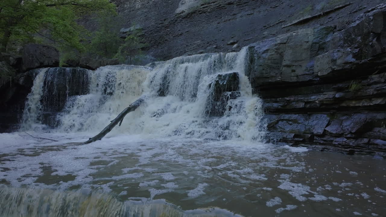 Peaceful waterfall cascades over rocks at Rockway Falls, Ontario in spring flow