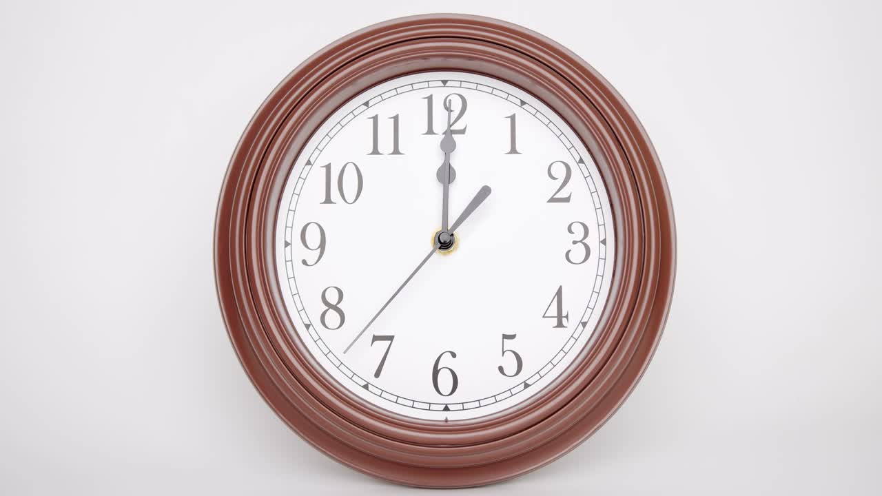 Classic style watch, brown case isolated on white Background showtime 12.02 am or pm.