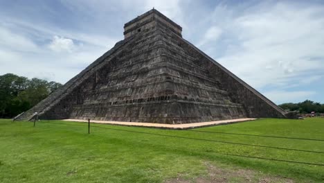 Handheld ultra wide angle tilting up shot from the corner of the pyramid of Kukulkan at Chichen Itza in Yucatan, Mexico. 4K