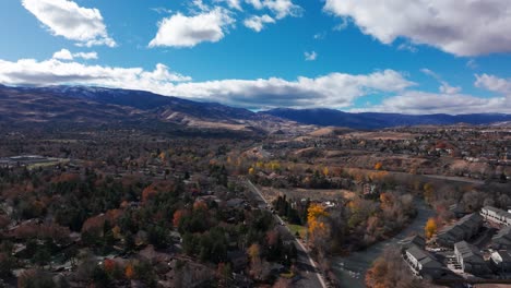 drone view flying over the river in reno, nevada near downtown