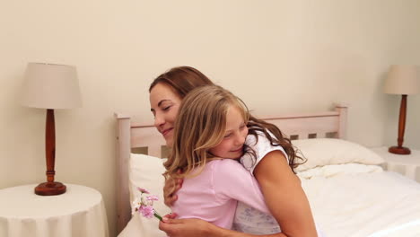 Little-girl-giving-her-mother-wild-flowers