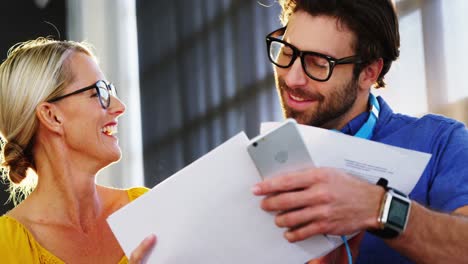 business executives looking at document