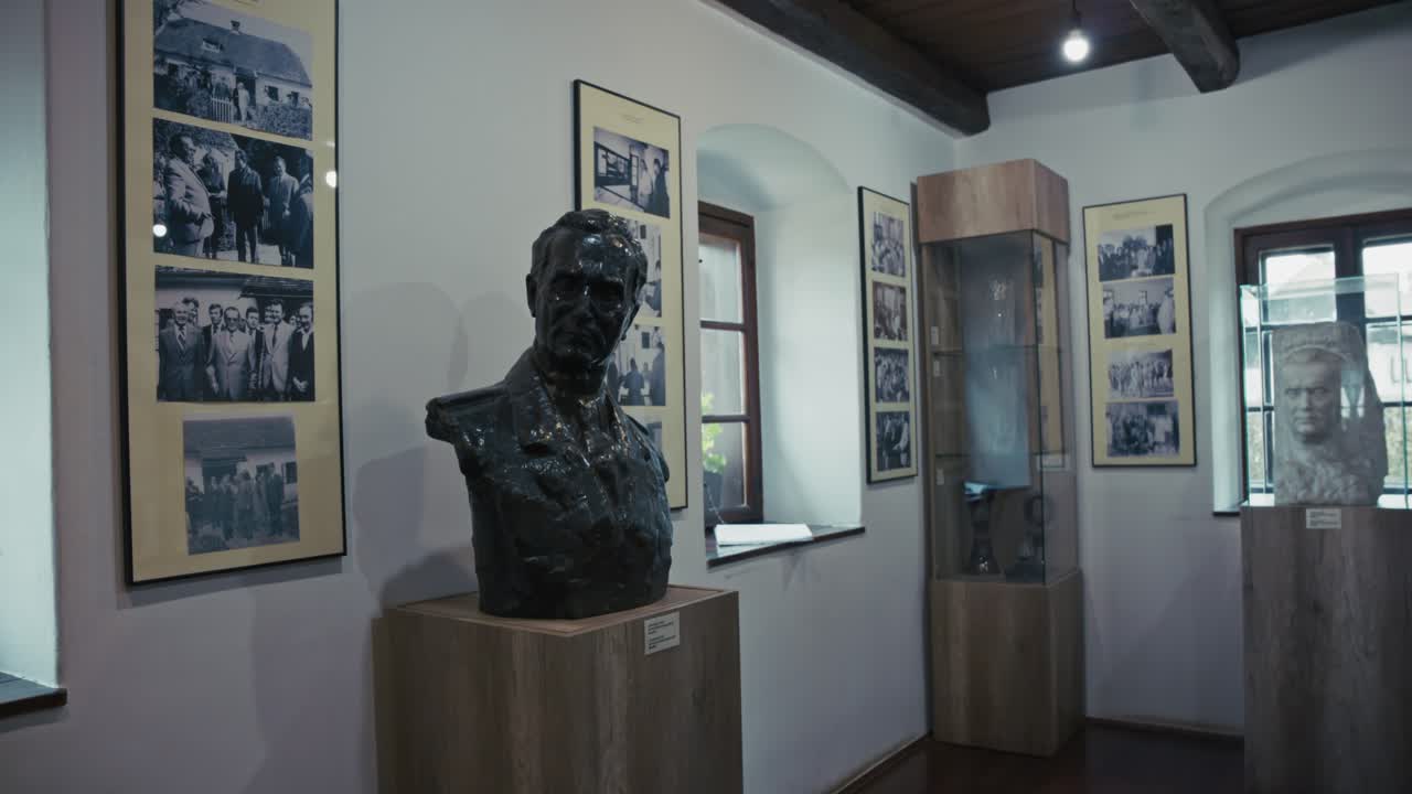 A Museum Exhibit Featuring a Bust of a Historical Figure