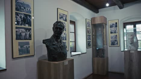 a museum exhibit featuring a bust of a historical figure