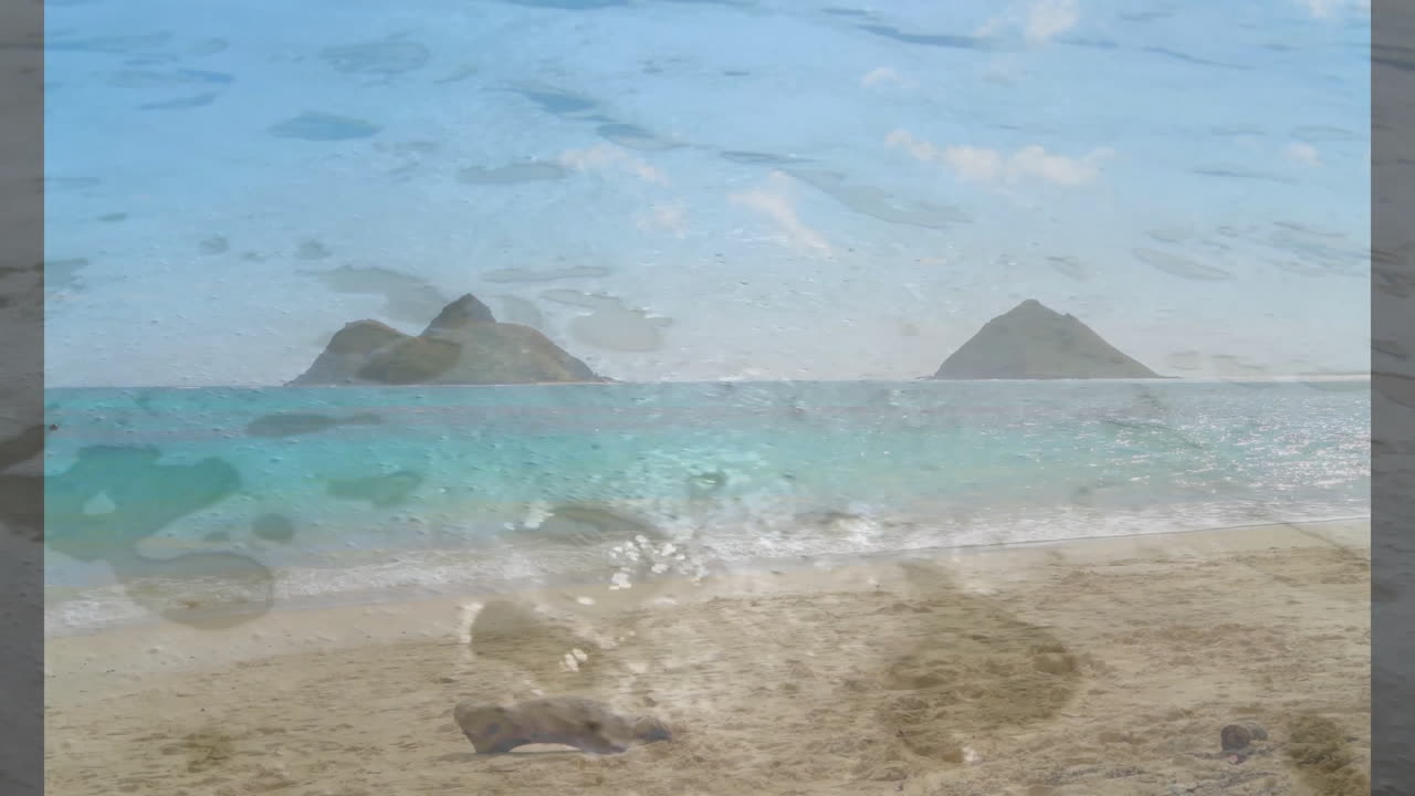 Ocean waves washing over sandy beach with animation of distant islands in background