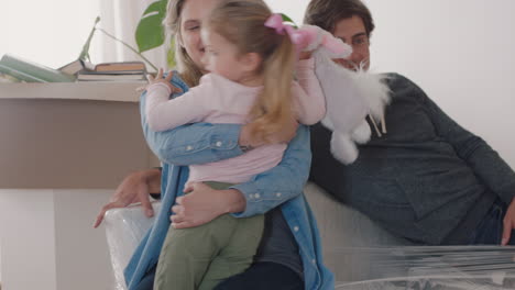 happy caucasian family moving into new home owners with children young couple successfully move into house enjoying real estate property investment together hugging kids 4k footage