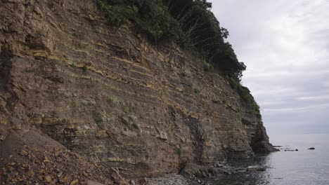 striations in ocean cliff at kada, wakayama japan