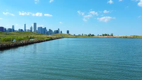 beautiful-drone-view-of-the-buildings-from-the-ocean---lake