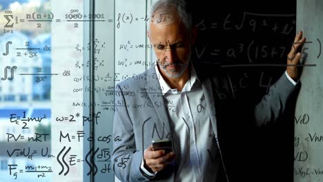 animation of mathematical equations over caucasian businessman using smartphone