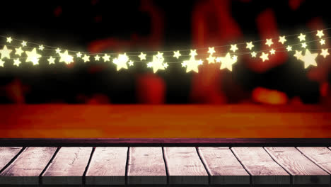 animation of fairy lights and over wooden boards