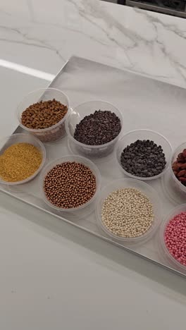 baking ingredients: chocolate, nuts, berries, and candy decorations