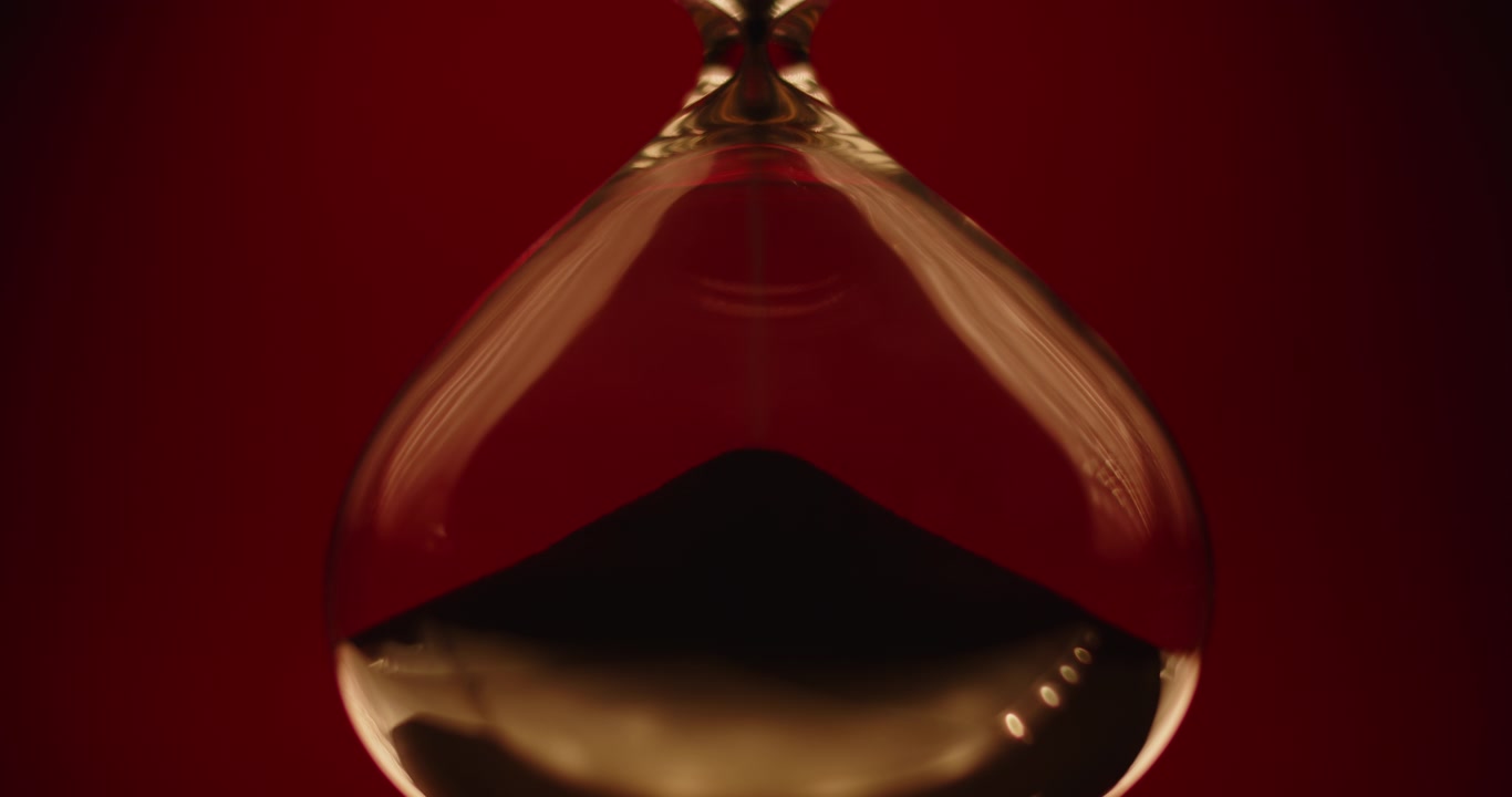 Beautiful sand clock on a red background