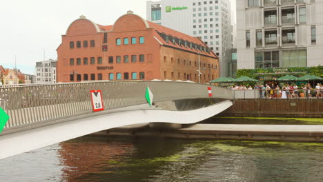modern bridge over motława river in gdańsk, poland