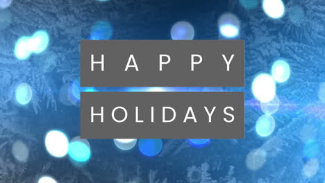 Animation-of-happy-holidays-text-over-glowing-spots-of-light-and-snowflakes-against-blue-background