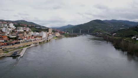 Peso-da-Régua-Cityscape-by-Douro-River,-Portugal---aerial