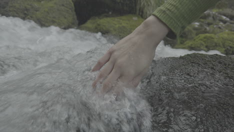 hand in a mountain stream