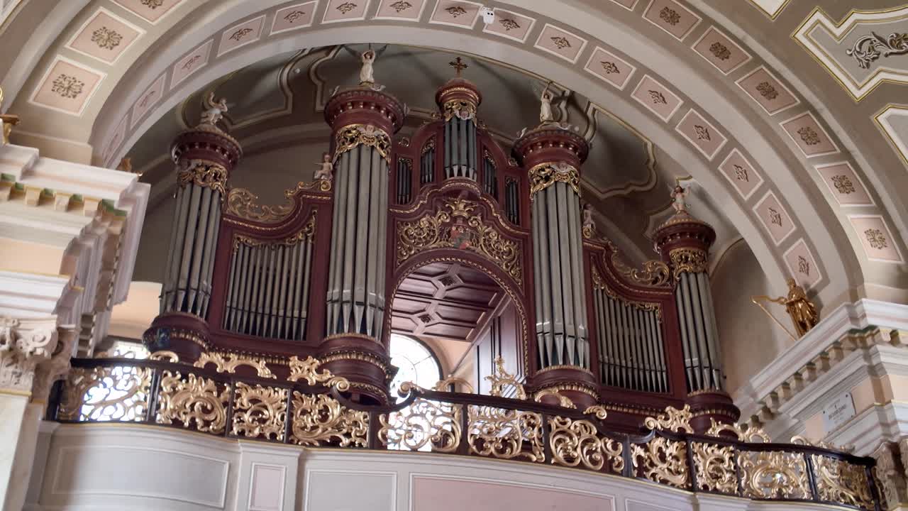 Timisoara landmark interior featuring the historic organ of Saint George’s Catholic Cathedral, framed by detailed architectural elements
