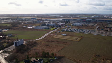 distant aerial view of gdansk airport, poland - dolly right