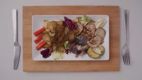plate of pork and vegetable salad