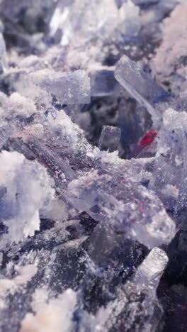 pattern of colorful organic crystals as background macro view. cosmetic product for wellness and spa service. minerals and stones in laboratory