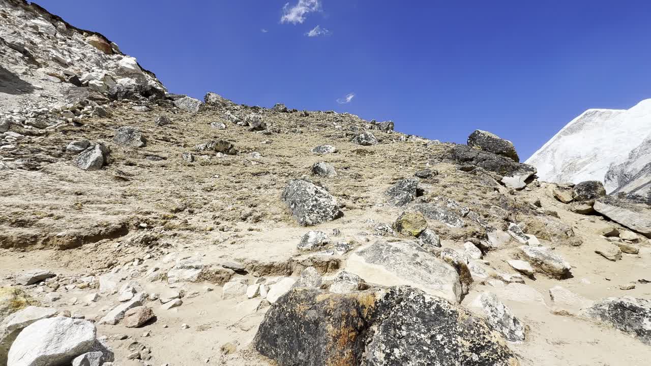 A powerful view capturing rugged rock faces and snow-covered peaks together in a single Himalayan frame—pure, untamed nature.
