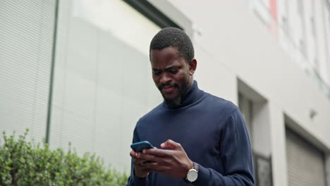 black man in city with smile