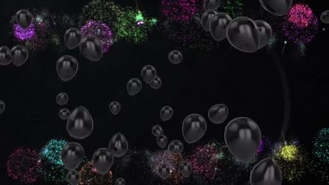 Animation-of-black-balloons-with-fireworks-on-black-background