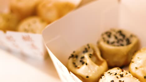 delicious pan-fried buns in a takeaway box