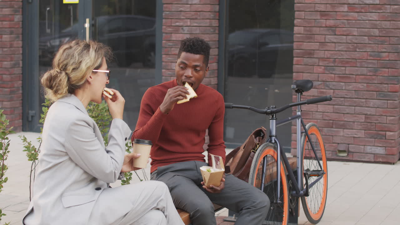 Business Couple Having Lunch Outdoors