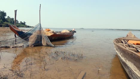 old fishing boats on the shore of the lake