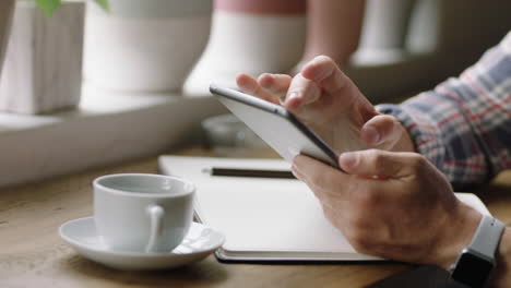 businessman using tablet computer in cafe taking photo of coffee sharing lifestyle on social media enjoying relaxing morning close up hands