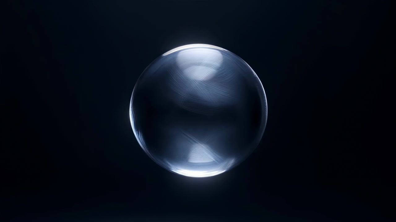 A clear glass-like sphere is isolated in the center against a deep black background, with soft highlights, subtle reflections, and a clean minimalist abstract