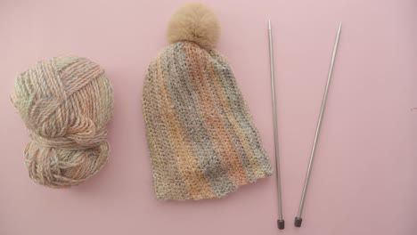 knitting supplies: yarn, hat, and needles