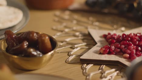 close up of food on muslim family table in home set for meal celebrating eid 10