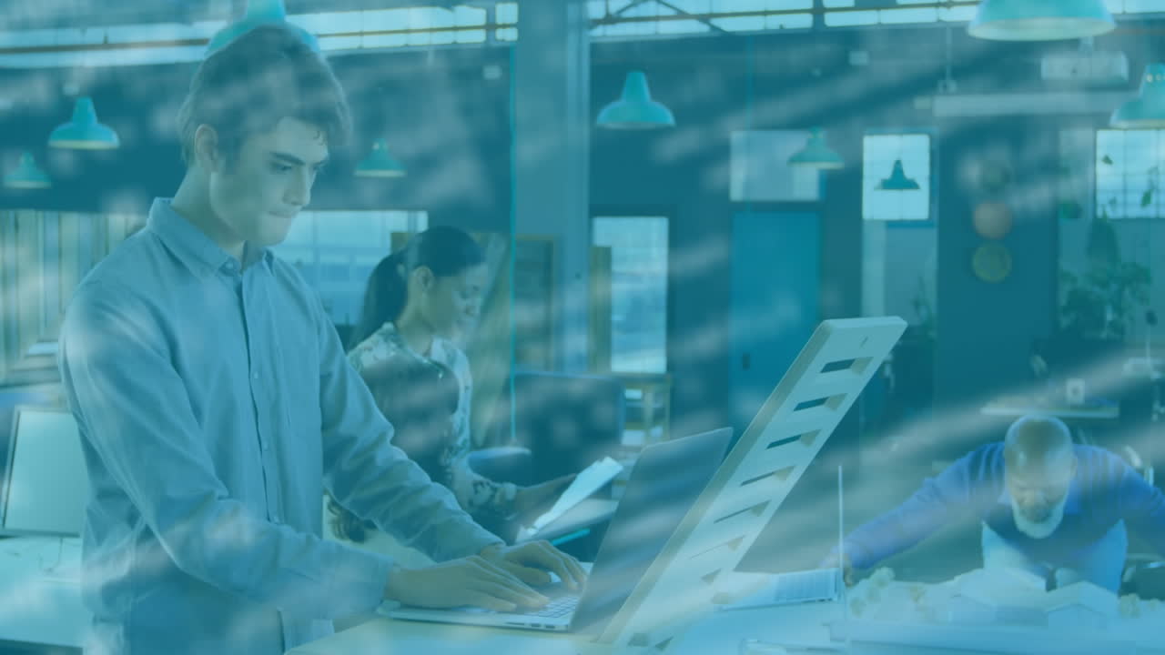 Animation of data processing over businessman using laptop
