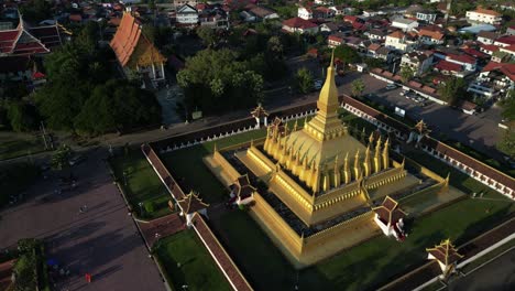 Aerial-drone-shot-of-Pha-That-Luang-Golden-Stupa-in-Vientiane,-Laos