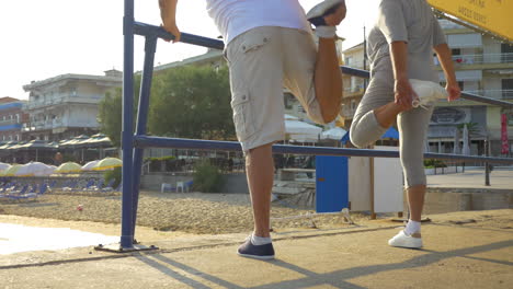 Man-and-woman-stretching-their-legs-outdoor