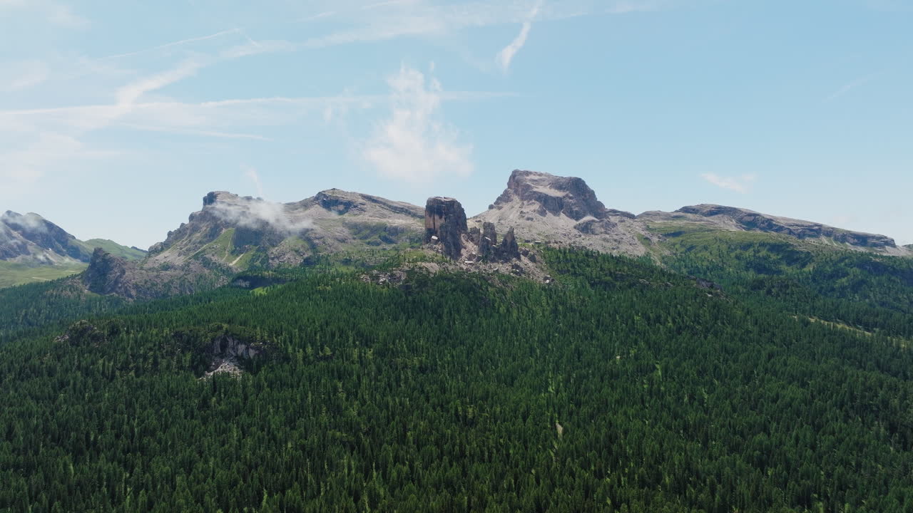 Panoramic drone shot of Unesco mountain range Cinque Torri in Dolomites, Italy during springtime