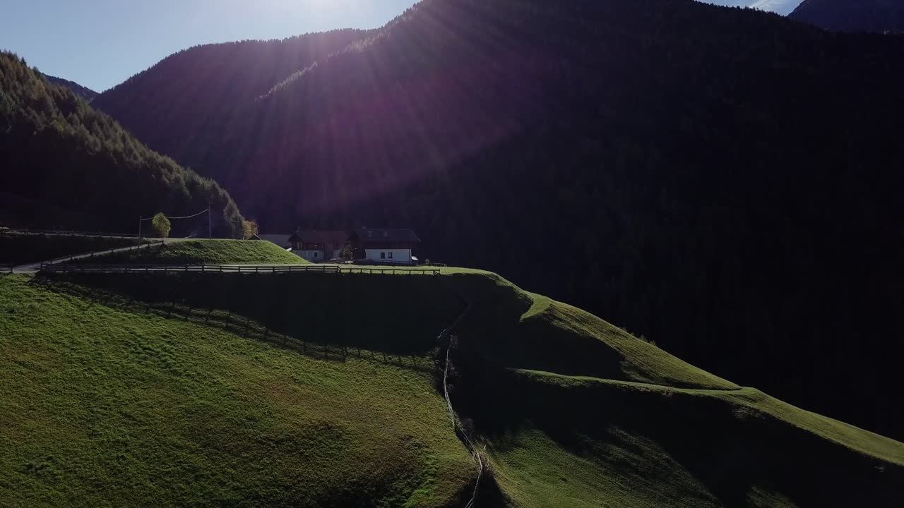 Mountain house on a hill with green grass