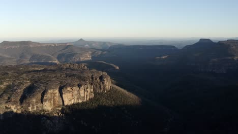 aerial shot of mountains during sunrise on a clear day