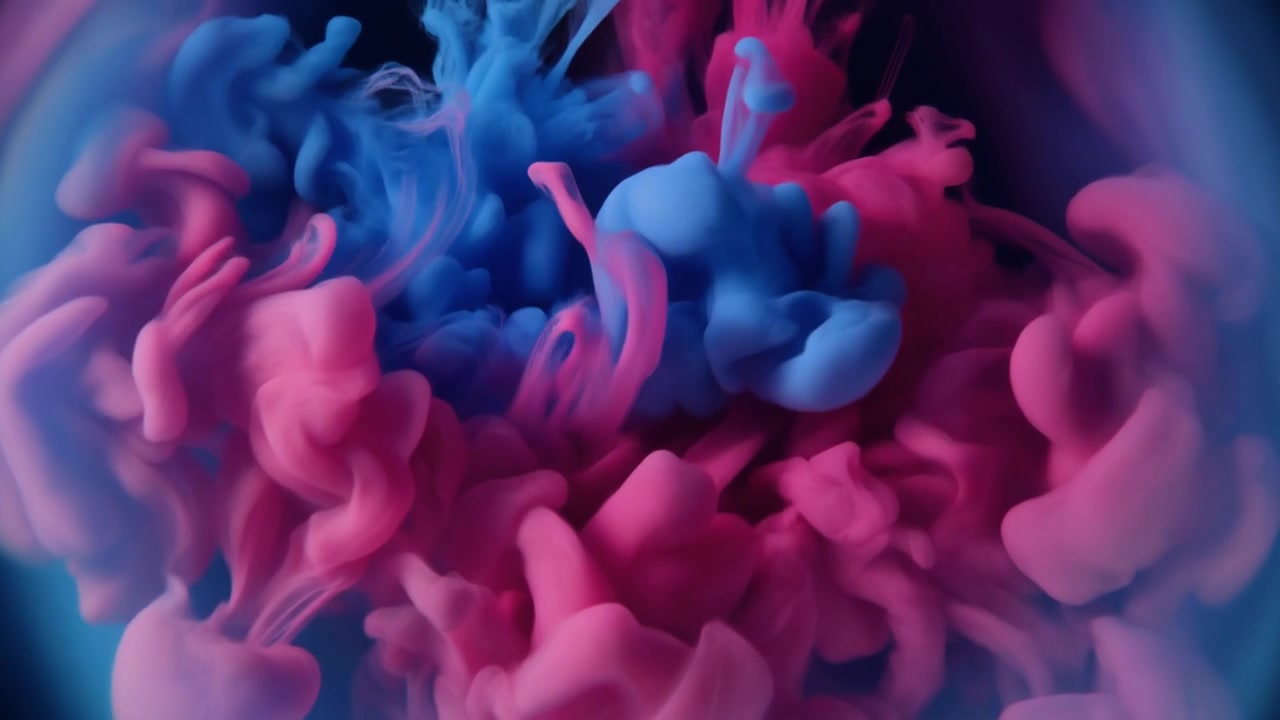 Pink and Blue Ink Clouds Swirling in Water