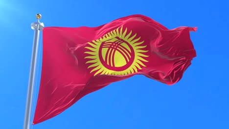 flag of kyrgyzstan waving at wind with blue sky in slow, loop