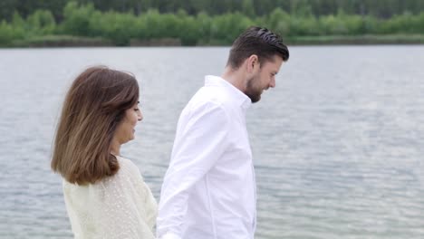couple walking hands in the sahara lake in belgium.
