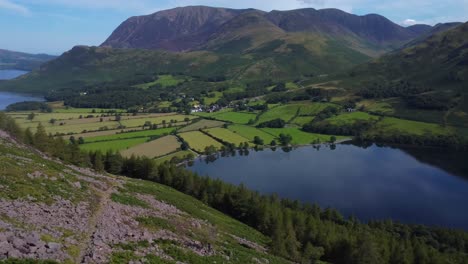 aerial 4k drone video overlooking lake buttermere and mountains in lake district uk