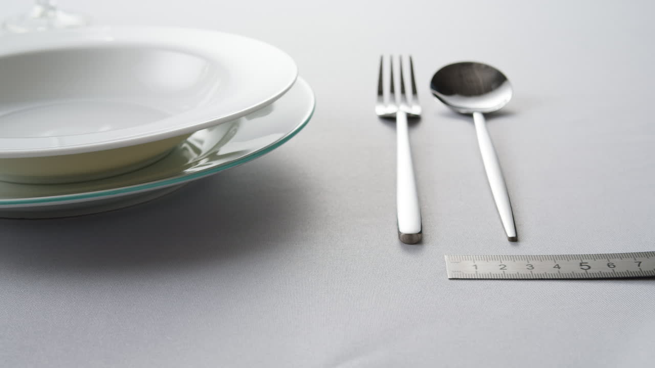 Table Setting with Cutlery and Measuring Tape